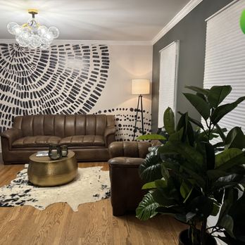 Gallagher Paint and Paper - Bold statement wall meets warm tones and clean lines -- a living room designed to draw your eye the moment you walk in. - Painters Near Me - Naperville, Illinois Gallagher Paint and Paper - Bold statement wall meets warm tones and clean lines -- a living room designed to draw your eye the moment you walk in. - Painters Near Me - Naperville, Illinois