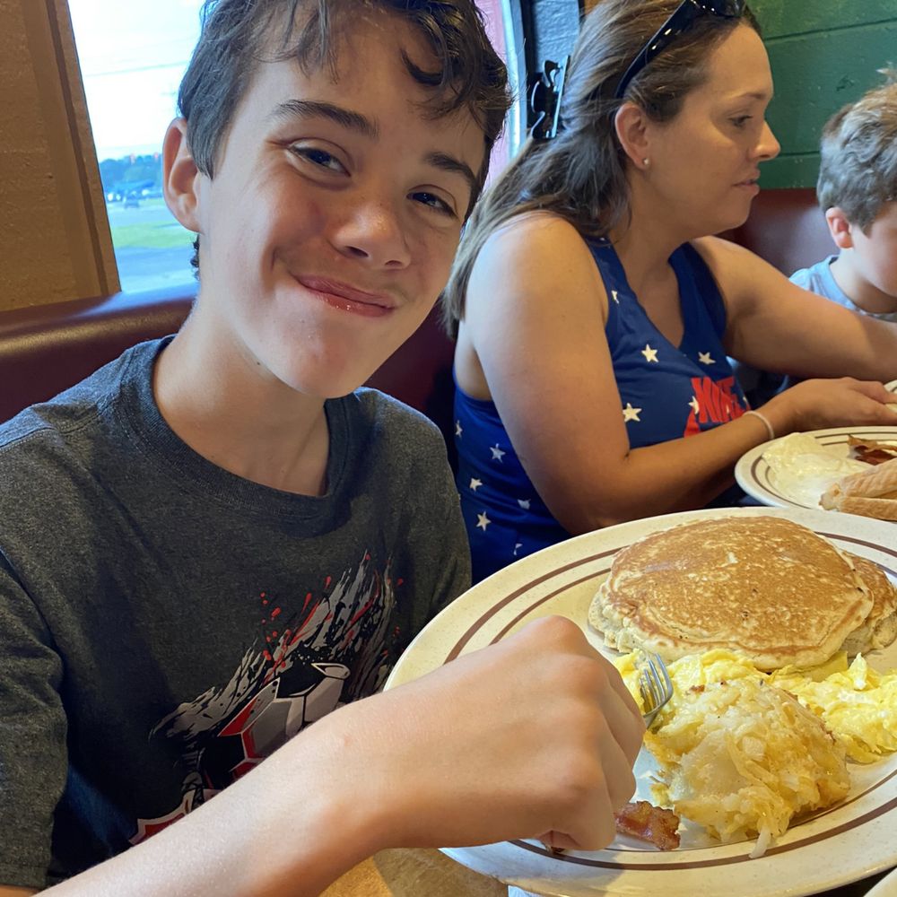 Pancakes with eggs bacon and hashbrowns Pancakes with eggs bacon and hashbrowns