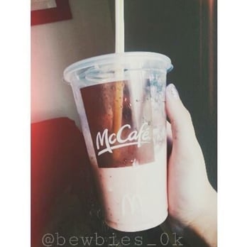 McDonald's - a hand holding a cup of coffee - Burgers Near Me - Denver, Colorado McDonald's - a hand holding a cup of coffee - Burgers Near Me - Denver, Colorado