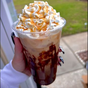 Crack'D - a hand holding a cup of ice cream and caramel - Food Trucks Near Me - Tampa, Florida Crack'D - a hand holding a cup of ice cream and caramel - Food Trucks Near Me - Tampa, Florida