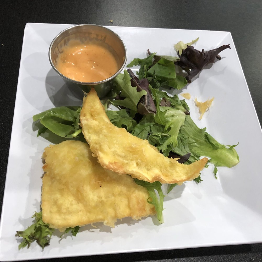 Rock N Roll Sushi - Fried Wantons. Took pic late...came with 5 pieces. Our waitress said this menu item is life changing. She is correct. YOU MUST TRY!! - Sushi Bars Near Me - Memphis, Tennessee