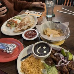 Shrimp, quesadilla and Pork Carnitas with black beans. The Texas margarita is tasty and potent. Shrimp, quesadilla and Pork Carnitas with black beans. The Texas margarita is tasty and potent.