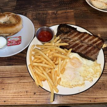 Roasters 'N Toasters North Miami Beach - Brisket Steak 'N Eggs with cinnamon bagel - Delis Near Me - North Miami Beach, Florida Roasters 'N Toasters North Miami Beach - Brisket Steak 'N Eggs with cinnamon bagel - Delis Near Me - North Miami Beach, Florida