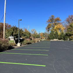 Main Line Gardens - Seal coated lot with new lime green stripes