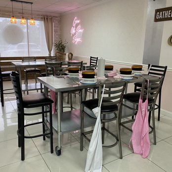 Cake It - a dining room with tables and chairs - Custom Cakes Near Me - Miami Lakes, Florida