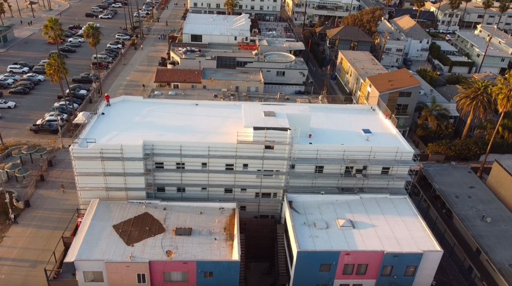 Slide of Honey Badger Roofing