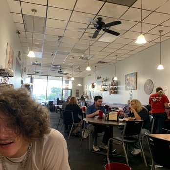 State line Diner - a woman sitting at a table - Diners Near Me - Danville, Virginia