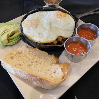 Scratch Kitchen & Cocktails - Hangover Hash with side avocado - New American Near Me - Norman, Oklahoma Scratch Kitchen & Cocktails - Hangover Hash with side avocado - New American Near Me - Norman, Oklahoma