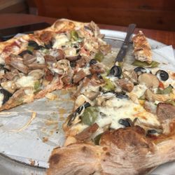 Wagon Wheel Pizza The - Pizza is so delicious!   It came out hot and generous amount of toppings.    Definitely will return when we come Back to the area.