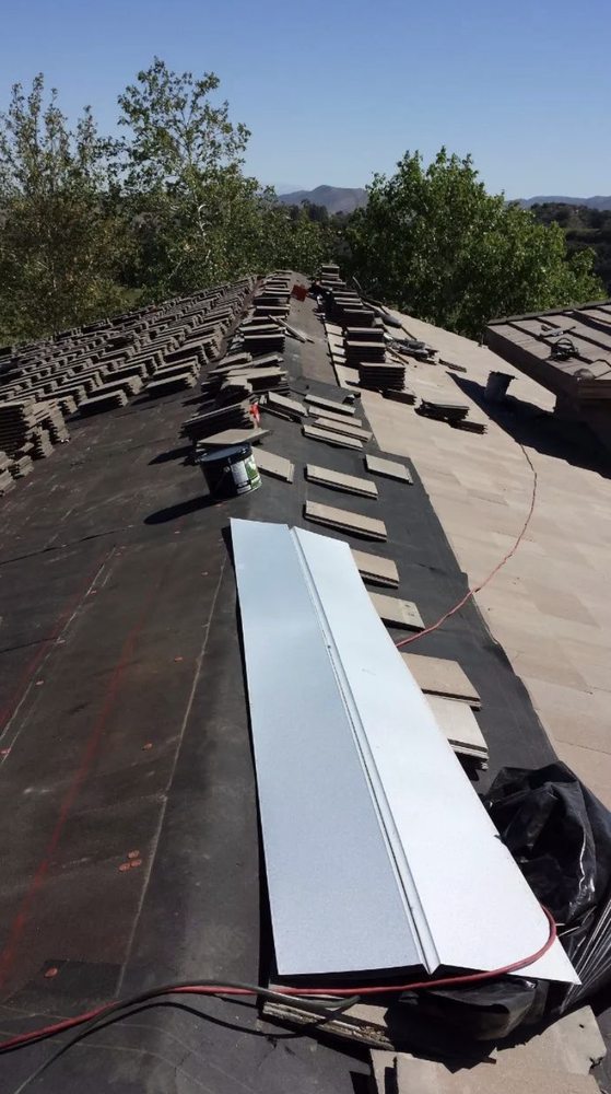 Slide of Romero's Roofing