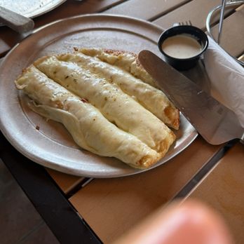 Pizza Place - Cheesebread comes with pizza sauce too. We took few pieces already - Pizza Near Me - Tropic, Utah