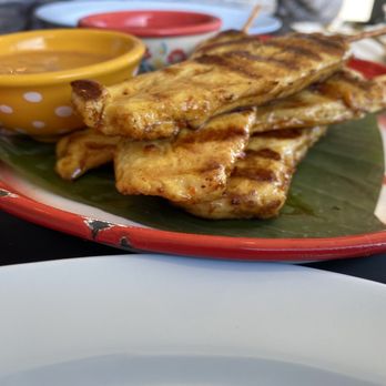 The Theo Thai Bistro - Chicken Satay side view - Thai Near Me - Bethpage, New York The Theo Thai Bistro - Chicken Satay side view - Thai Near Me - Bethpage, New York