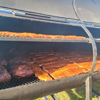 CG BBQ - ribs and meat cooking on a charcoal grill - Food Trucks Near Me CG BBQ - ribs and meat cooking on a charcoal grill - Food Trucks Near Me