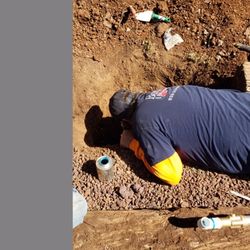 David Barber Plumbing - David breaking concrete at the bottom of hole