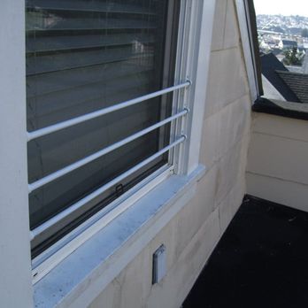 The Childproofer - Custom Iron Bars for the window - painted white. - Childproofing Near Me The Childproofer - Custom Iron Bars for the window - painted white. - Childproofing Near Me