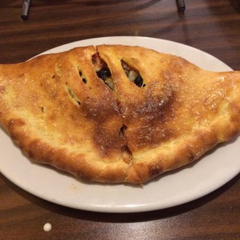 Buono's Pizzeria - Pineapple and black olive calzone. It's huge! - Pizza Near Me - Long Beach, California Buono's Pizzeria - Pineapple and black olive calzone. It's huge! - Pizza Near Me - Long Beach, California