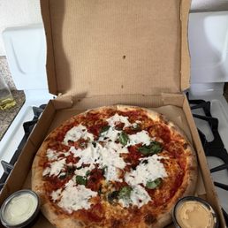 House pizza with the classic ranch on the left and spicy ranch on the right 10/10 delicious!