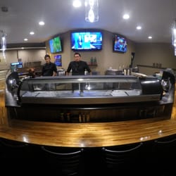 Hon Sushi - The best seat in the house! able to watch all three 50 inch TVs at once!