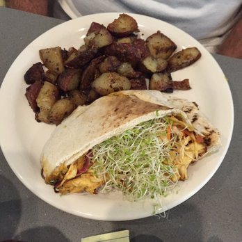 Manatee Cafe - Cajun chicken pita with carrots and sprouts....famous home fries on the side - Breakfast & Brunch Near Me - Saint Augustine, Florida Manatee Cafe - Cajun chicken pita with carrots and sprouts....famous home fries on the side - Breakfast & Brunch Near Me - Saint Augustine, Florida