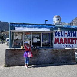 a woman standing in front of a store