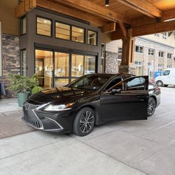 Seattle Exclusive Limo & Town Car - Luxury sedan parked outside my condominium to pick me up for an airport transfer