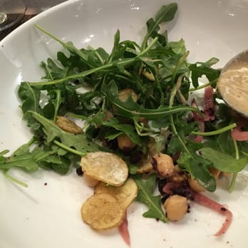 One Flew South - Ruccola and chick pea salad. Had these tiny chips made with feta cheese. Nice. - New American Near Me - Atlanta, Georgia