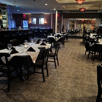 Jazzeppi's - an empty restaurant with tables and chairs - Italian Near Me - Biloxi, Mississippi