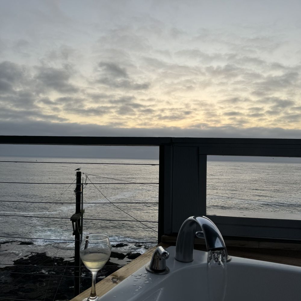 View from our balcony bath tub. With wine that was for purchase in the room