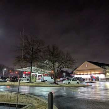 Wawa - a parking lot at night with cars parked in the lot - Convenience Stores Near Me - New Castle, Delaware