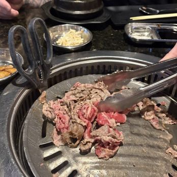U-Grill Korean BBQ - A broken grill with scissors holding the plate so the flame don't go out. - Korean Near Me - Rancho Cucamonga, California U-Grill Korean BBQ - A broken grill with scissors holding the plate so the flame don't go out. - Korean Near Me - Rancho Cucamonga, California