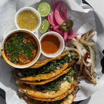 Outside The Masa - Quesa Tacos - all hooked up. Consommé, grilled onions , pickled onions, both salsas !! Bam!! - Mexican Near Me - Indio, California Outside The Masa - Quesa Tacos - all hooked up. Consommé, grilled onions , pickled onions, both salsas !! Bam!! - Mexican Near Me - Indio, California