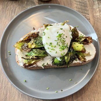 Two Birds Cafe - Fried brussels sprouts toast w/whipped goats cheese and a poached egg on top - Cafes Near Me - West Chester, Pennsylvania Two Birds Cafe - Fried brussels sprouts toast w/whipped goats cheese and a poached egg on top - Cafes Near Me - West Chester, Pennsylvania