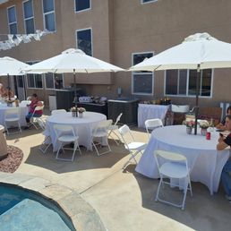 The tables, chairs, linens and umbrellas.