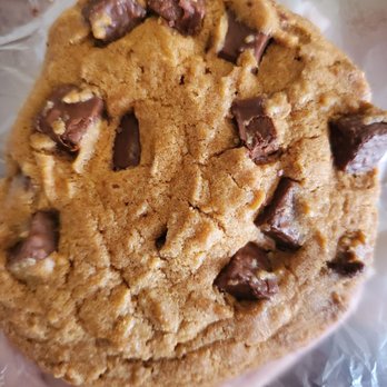 7-Eleven - a hand holding a chocolate chip cookie - Convenience Stores Near Me - Linden, New Jersey
