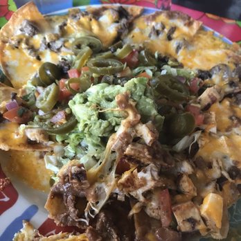 Hula Hut - Palm tree hugger Nachos - combination (chicken and beef)  Sour cream and guac = extra charge - Tex-Mex Near Me - Austin, Texas