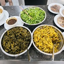 Dawanmien - The fixings:  fresh cilantro, (left) pickled mustard greens and preserved shredded vegetables