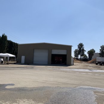 O.F. Wolfinbarger - a parking lot with a garage and a truck - Nurseries & Gardening Near Me - Chino, California O.F. Wolfinbarger - a parking lot with a garage and a truck - Nurseries & Gardening Near Me - Chino, California