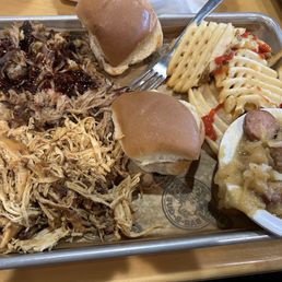 Combo no.2 pull pork and pulled Chicken , waffle fries Nd cabbage and sausage. Yummy