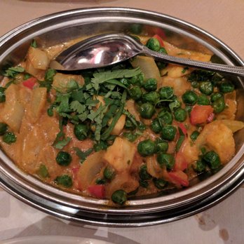 Mysore Fine Cuisine Indienne - a bowl of food with a spoon in it - Indian Near Me - Montreal, Quebec Mysore Fine Cuisine Indienne - a bowl of food with a spoon in it - Indian Near Me - Montreal, Quebec