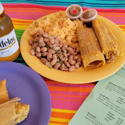 Variety of tamales. Yellow is the lunch combo with rice and beans. Variety of tamales. Yellow is the lunch combo with rice and beans.