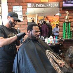Uppercutz Barbershop - Steelers Legend and Hall of Famer Jerome Bettis, and all of his security in the background.
