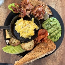 Palm Breakfast - eggs, bacon, potatoes, tomatoes, avocado, and the best toast you've ever tasted.