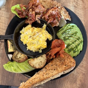 Sunny Eggs - Palm Breakfast - eggs, bacon, potatoes, tomatoes, avocado, and the best toast you've ever tasted. - Juice Bars & Smoothies Near Me - Key West, Florida