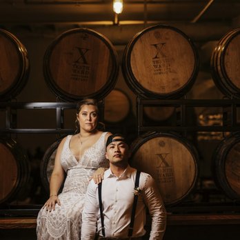Tenth Ward Distilling Company - a bride and groom in front of barrels - Distilleries Near Me - Frederick, Maryland Tenth Ward Distilling Company - a bride and groom in front of barrels - Distilleries Near Me - Frederick, Maryland