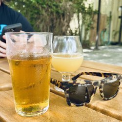 Hazy IPA (small glass) and Wheat Lager in larger glass