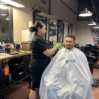 Da Man Barber Shop - The environment. Also a person getting a haircut by the most best barber. - Barbers Near Me - Glendale, Arizona