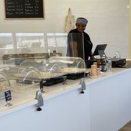 a woman behind the counter a woman behind the counter