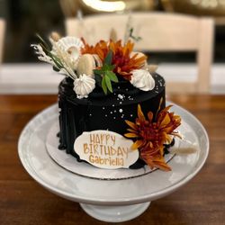 Laurannae - This was already beautifully decorated with white daisies but I swapped them out for the orange chrysanthemums to match an arrangement.