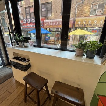 Artbean Coffee - 2 wooden benches by the window - Art Galleries Near Me - New York, New York