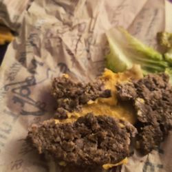 Blake's Lotaburger - Dry ,old nasty burger with brown and rotten romaine lettuce, green ,underripe tomato and a dry hard bun.